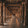 Ramanathaswamy Temple long corridor with ornate stone pillars stretching into the distance in Rameshwaram