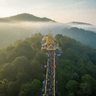Sabarimala temple nestled in the lush green Western Ghats forest hills of Kerala at dawn